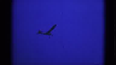 Middletown Pennsylvania (1975): An Airplane Flying In The Sky A Plant In The Pot