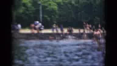 Middletown Pennsylvania (1975): People Swimming In Body Of Water Near Parking Area