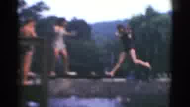 Middletown Pennsylvania (1975): People Line Up On Diving Board As Woman Jumps Into