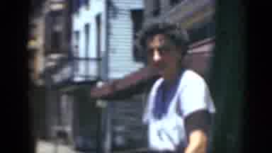 Middletown Pennsylvania (1975): A Lady Walks By A Car While Saying Something And