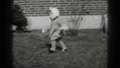 Middletown Pennsylvania (1975): Small Child Runs Across The Grass In The Outside