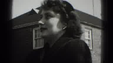 Middletown Pennsylvania (1975): Child Wearing White Hat Jumps On Sidewalk While