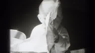Middletown Pennsylvania (1975): Baby Sitting On Floor Trying To Put Newspaper Into