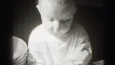 Middletown Pennsylvania (1975): A Baby Sitting And Playing With A Piece Of Fabric