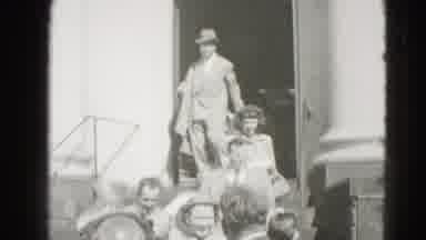 Middletown Pennsylvania (1975): People Dressed In 50s Style Exit A Building And