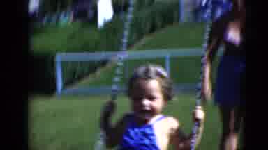 Middletown Pennsylvania (1975): A Mother Playing With Her Two Kids Outside She Is