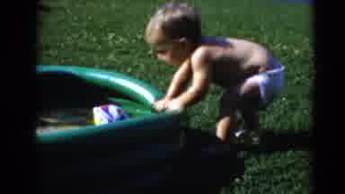 Middletown Pennsylvania (1975): Toddler Play In A Kiddie Pool With A Ball