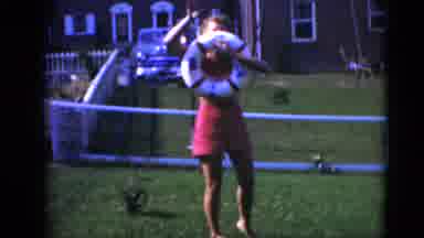 Middletown Pennsylvania (1975): Woman Waves While Holding Life-Ring Float