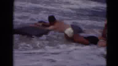 Middletown Pennsylvania (1975): Man And Woman Riding Waves On Pool Float And End