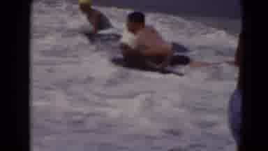 Middletown Pennsylvania (1975): Kids Running From Breaking Waves As Families