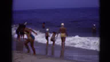 Middletown Pennsylvania (1975): Many Families Playing Together In The Ocean As