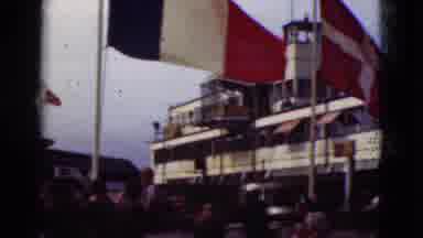 Denmark (1975): Camera Shows Off A Large Deck Flying Several Different Flags As