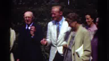 Denmark (1975): Adults In Suits Or Dresses Gathered Around On A Sunny Day Having A