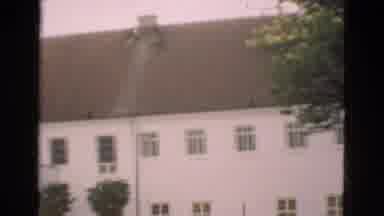 Denmark (1975): A Slow Moving View Across A Three-Story Building
