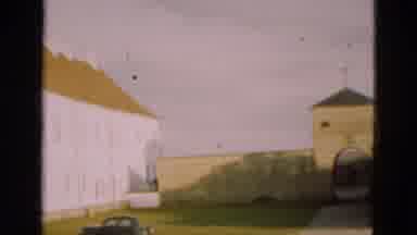 Denmark (1975): Black Car Parked At White Building With Brown Roof On A Bright