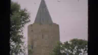Denmark (1975): Tall Building With Spire And Large House Near Roadside Trees