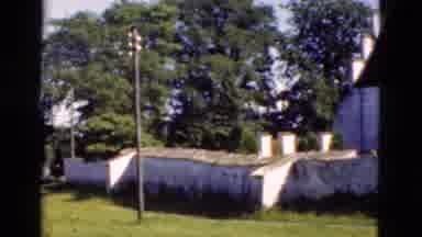 Denmark (1975): The Tall White Building Makes Stone Wall Look Tiny In Comparison