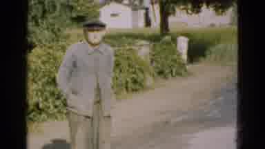 Denmark (1975): Old Timer Standing In A Driveway With A White House In A Field