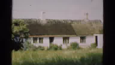 Denmark (1975): Old House Stands Tall Against A Backdrop Of Tall Trees And Green