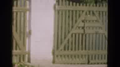 Denmark (1975): A Gate Blows Open From The Wind Of A Wooden Fence