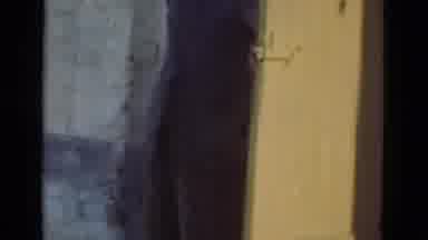 Denmark (1975): Man In Blue Jacket Closing A Large Brown Wooden Door With Metal