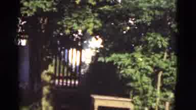 Denmark (1975): Man Closing Gate Fence White House Windows Thatch Trees Door