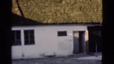 Denmark (1975): Sunny Outdoor View Of Camera Panning A One Floor Building In A