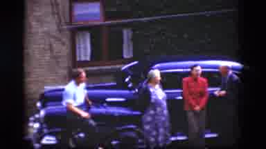 Denmark (1975): Family Members Enjoying Each Other Company Around The Family Car