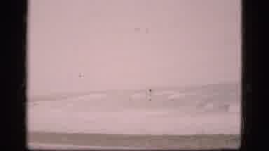 Denmark (1975): Waves Crashing Into Beach Around A Jetty