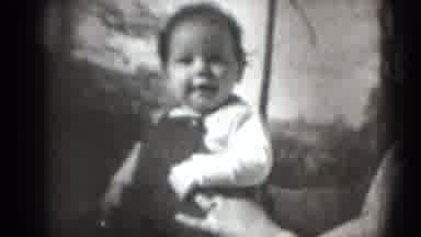 Middletown Pennsylvania (1975): Baby Wearing White Shirt Sits And Smiles For The