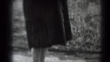 Middletown Pennsylvania (1975): A Woman In A Fur Coat With A Small Dog Walks Down