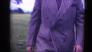 MIDDLETOWN PENNSYLVANIA-1975: Man Wearing A Suit Walks Towards The Camera And Smiles