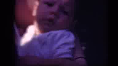 Middletown Pennsylvania (1975): A Baby Being Cared For Gently By A Woman In The