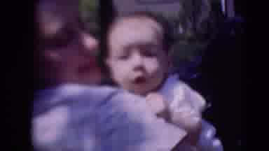 MIDDLETOWN PENNSYLVANIA-1975: Mother Holds Baby In Car And Rocks Gently