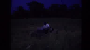 Middletown Pennsylvania (1975): A Baby Being Burped While A Farmer Plows A Field