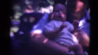 Middletown Pennsylvania (1975): Outdoors Film Of Man Holding Baby In The Shade