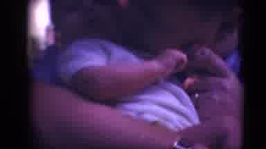 Middletown Pennsylvania (1975): Man Wearing Glasses Holds And Kisses Baby Wearing