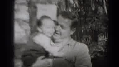 MIDDLETOWN PENNSYLVANIA-1975: Father Holds Baby Close And Gives Kisses To The