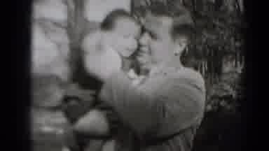 Middletown Pennsylvania (1975): A Man Standing Outside Playing With His Baby
