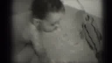 Middletown Pennsylvania (1975): A Small Child Taking A Bath While Being Held Up