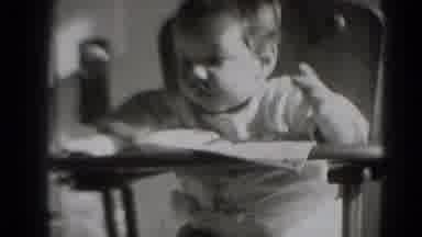 Middletown Pennsylvania (1975): Black And White Pan Of A Baby Sitting On A High