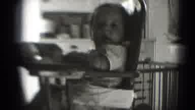 Middletown Pennsylvania (1975): Baby Awaiting Meal Is Captivated By Camera