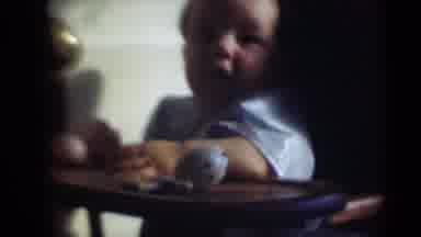 Middletown Pennsylvania (1975): Baby Is Sitting On A High Chair And Looking