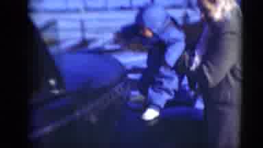 Middletown Pennsylvania (1975): A Father Holding His Baby Up On Good Of Car And