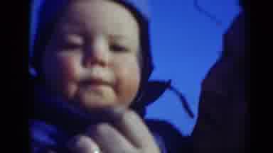 Middletown Pennsylvania (1975): A Man Holding A Baby And Tickling His Mouth Man
