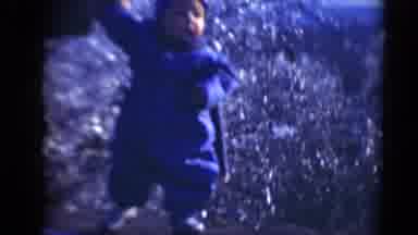 Middletown Pennsylvania (1975): Someone Holds Baby's Hand To Help Baby Stand Up In