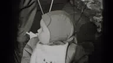 Middletown Pennsylvania (1975): Baby Looks Around While Wearing A Tight Cap And