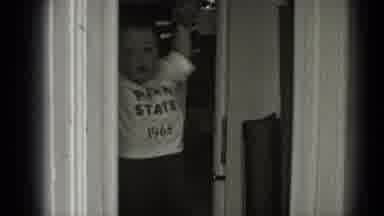 Middletown Pennsylvania (1975): A Mother Helps Baby Learning To Walk Enter A Room