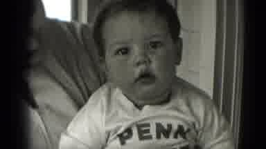 Middletown Pennsylvania (1975): Smiling Happy Boy Waves Arms Wearing A Penn State