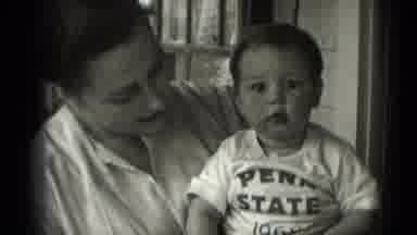 Middletown Pennsylvania (1975): Woman Holding Baby Wearing Penn State 1968 Tshirt